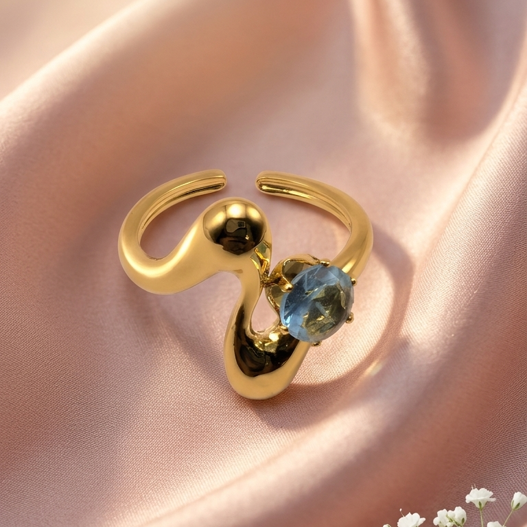 Gold abstractring with a blue Gemstone