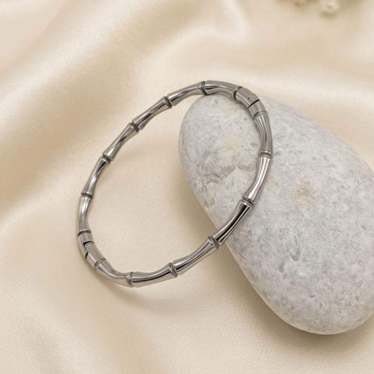 silver-toned bangle kada with a bamboo