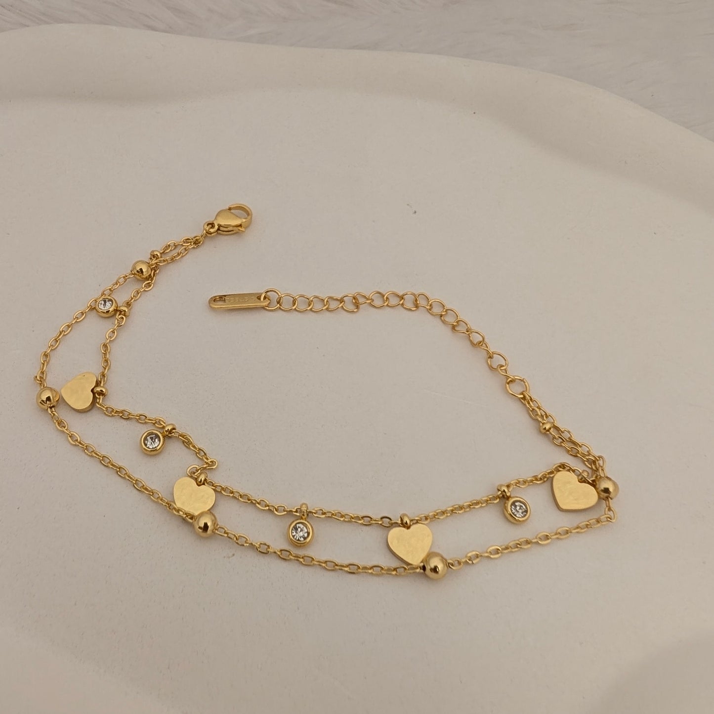 Gold layered bracelet with heart-shaped charms