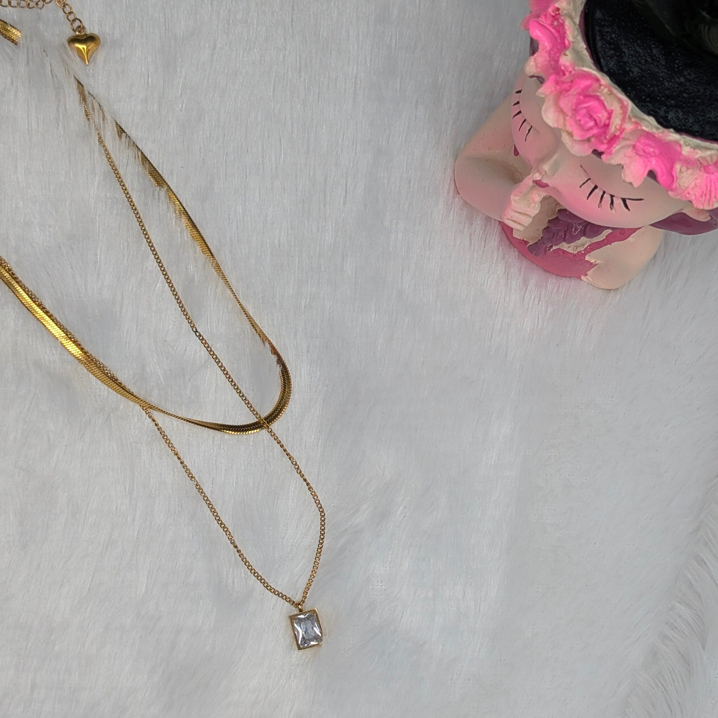 Gold necklace with a clear gemstone