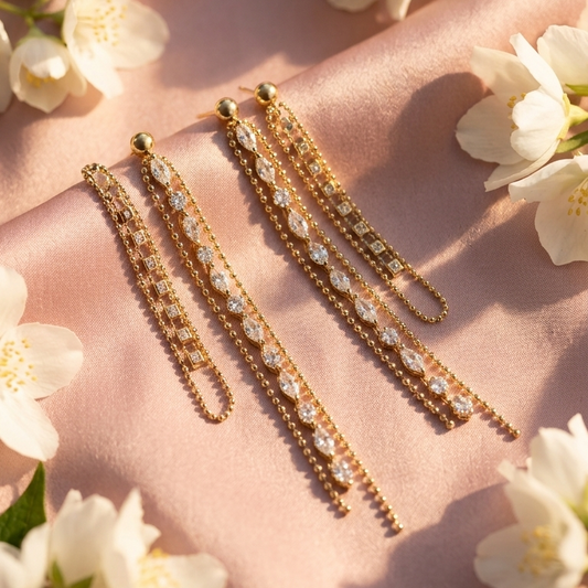 Three gold-toned statement earrings