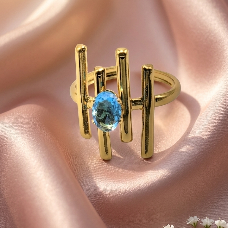 Gold abstractring witha ovel blue Gemstone