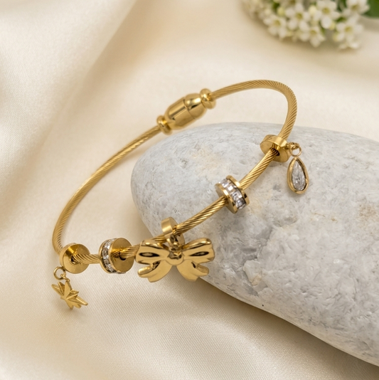  Gold bangle kada with bow and bead charms