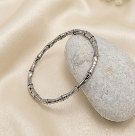 silver-toned bangle kada with a bamboo