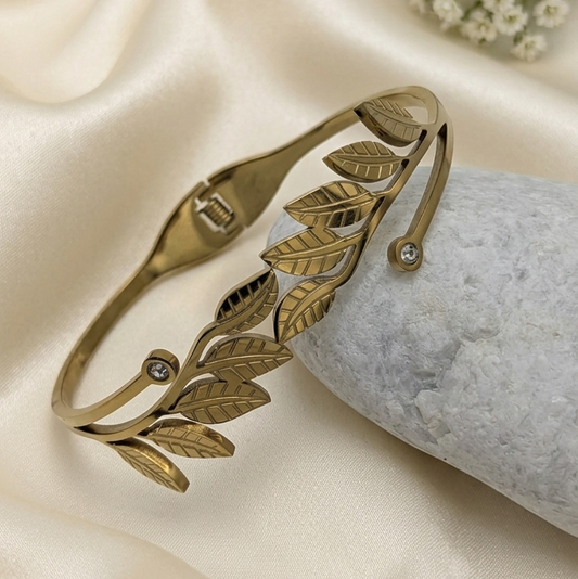  gold-toned open cuff bangle kada with an engraved leaf pattern 