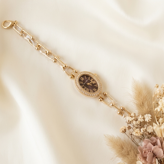 Gold-toned oval center pieced stones watch