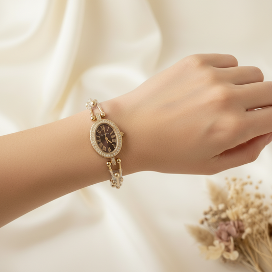 Gold-toned oval center pieced stones watch