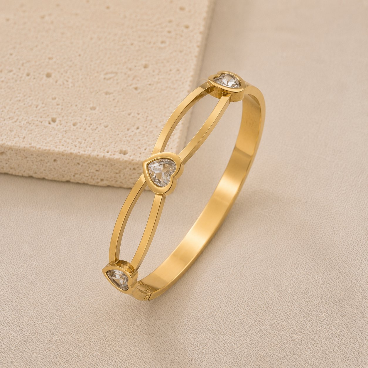Gold bracelet with heart-shaped