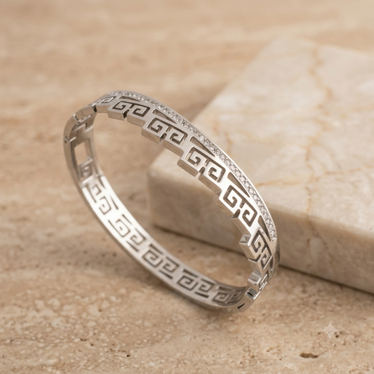 Silver bracelet with Greek key design and studded white stones