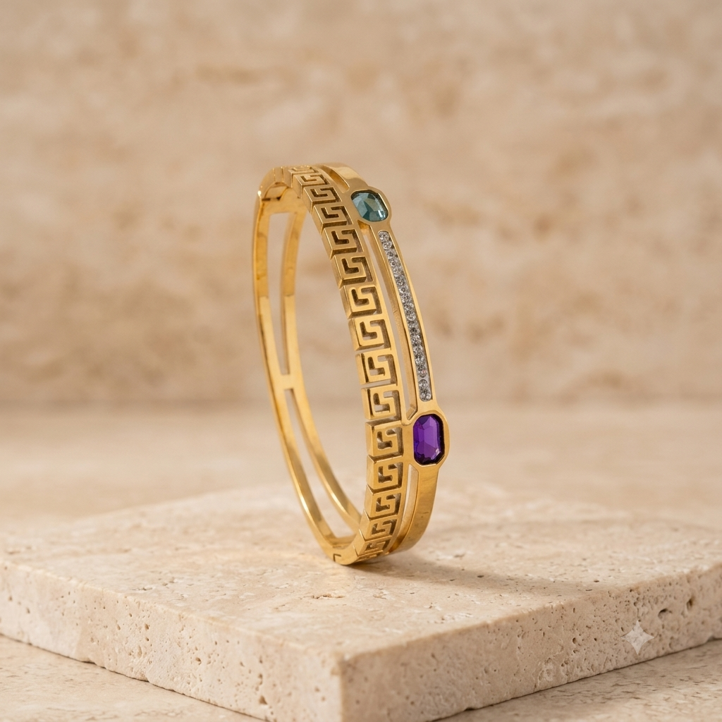gold bracelet with blue and sea green emerald and white stones studded