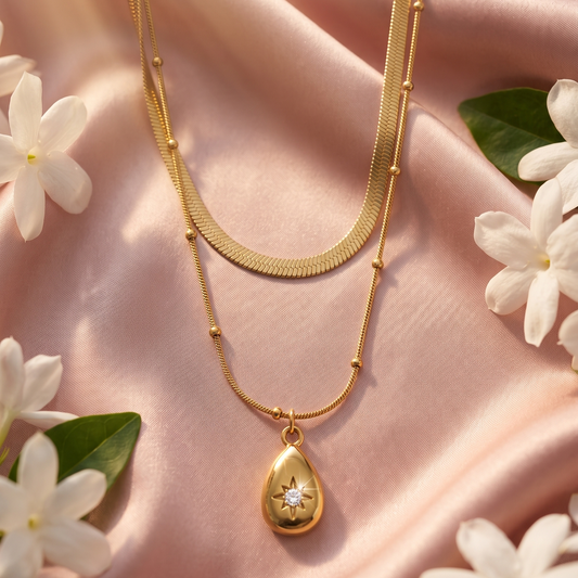 Layered Gold necklace with a teardrop pendant