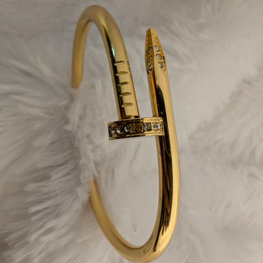 gold nail bracelet with stones