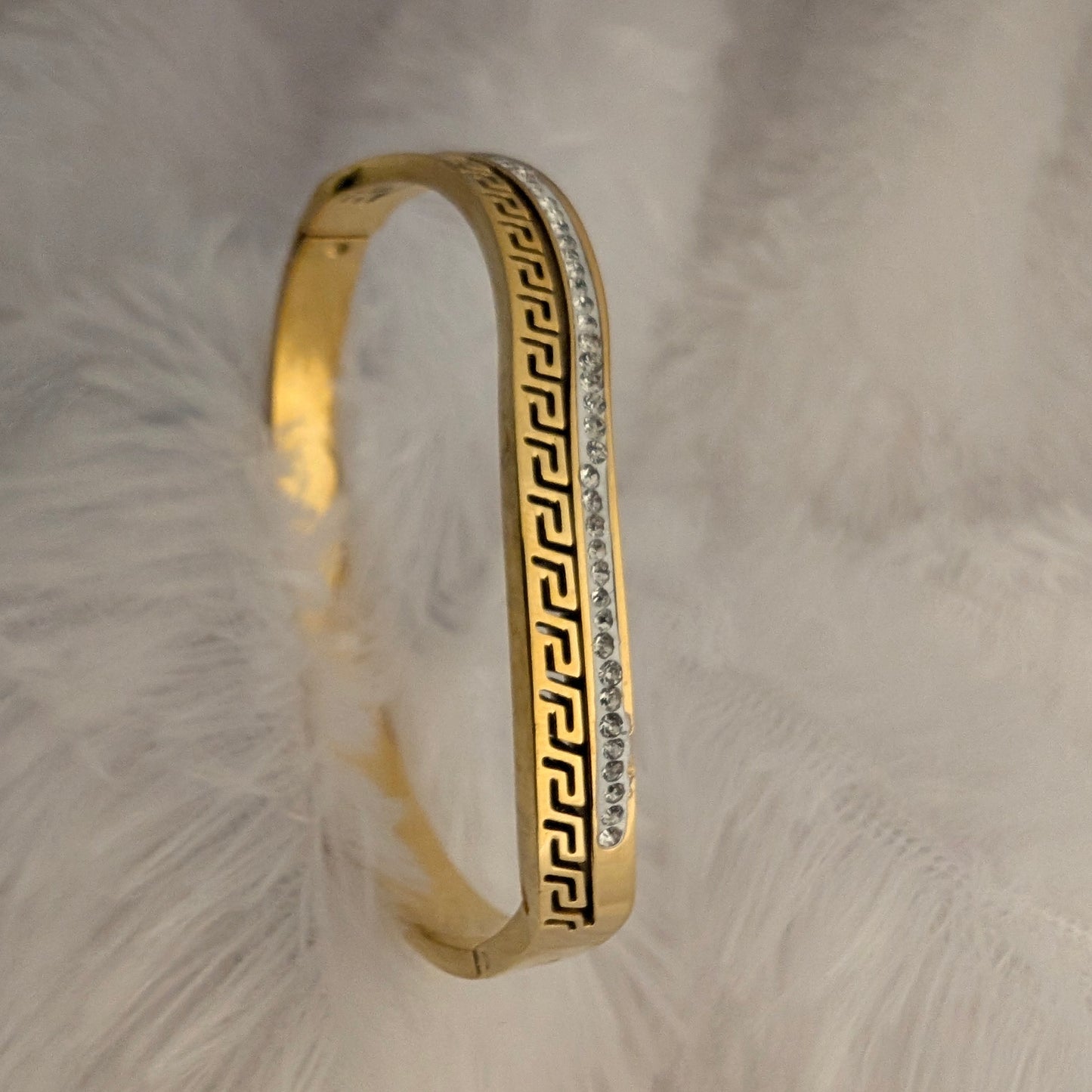 Gold bracelet with greek design and stones