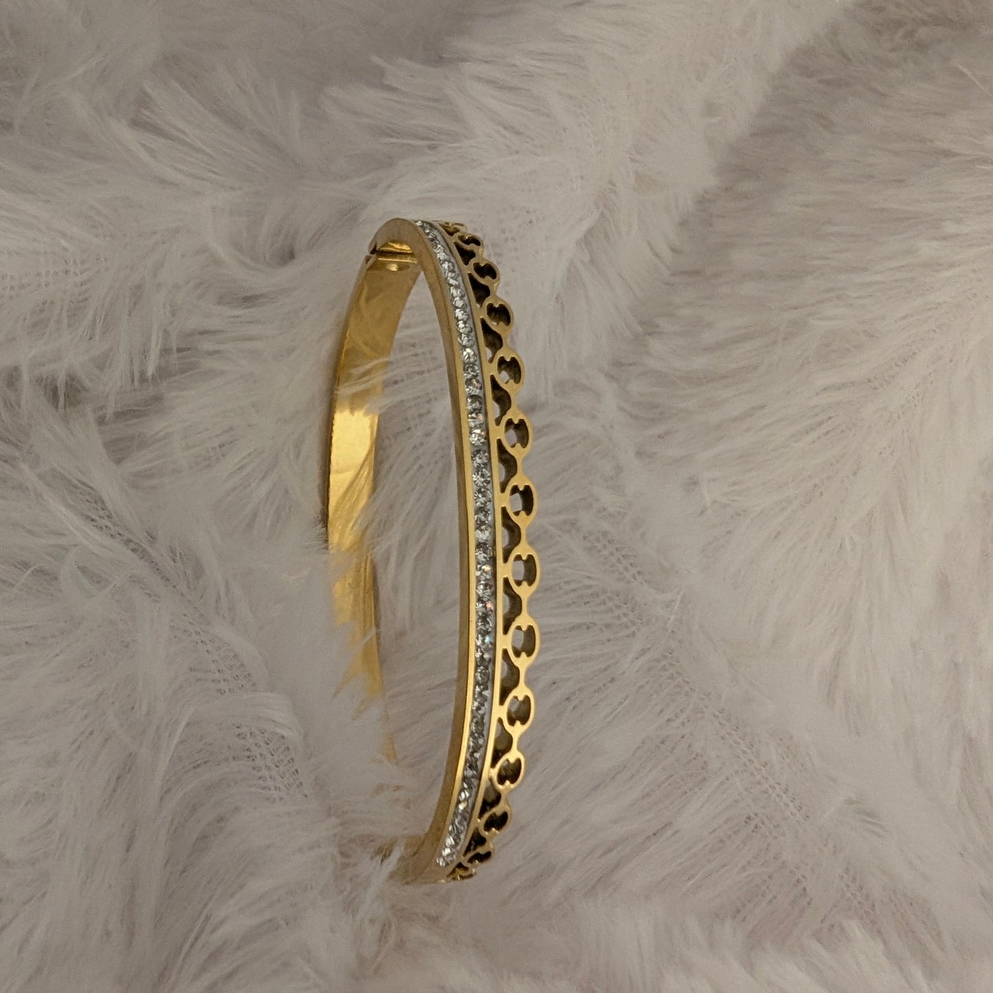 Gold bracelet with intricate design and studded white stones 18k gold plated antitarnish