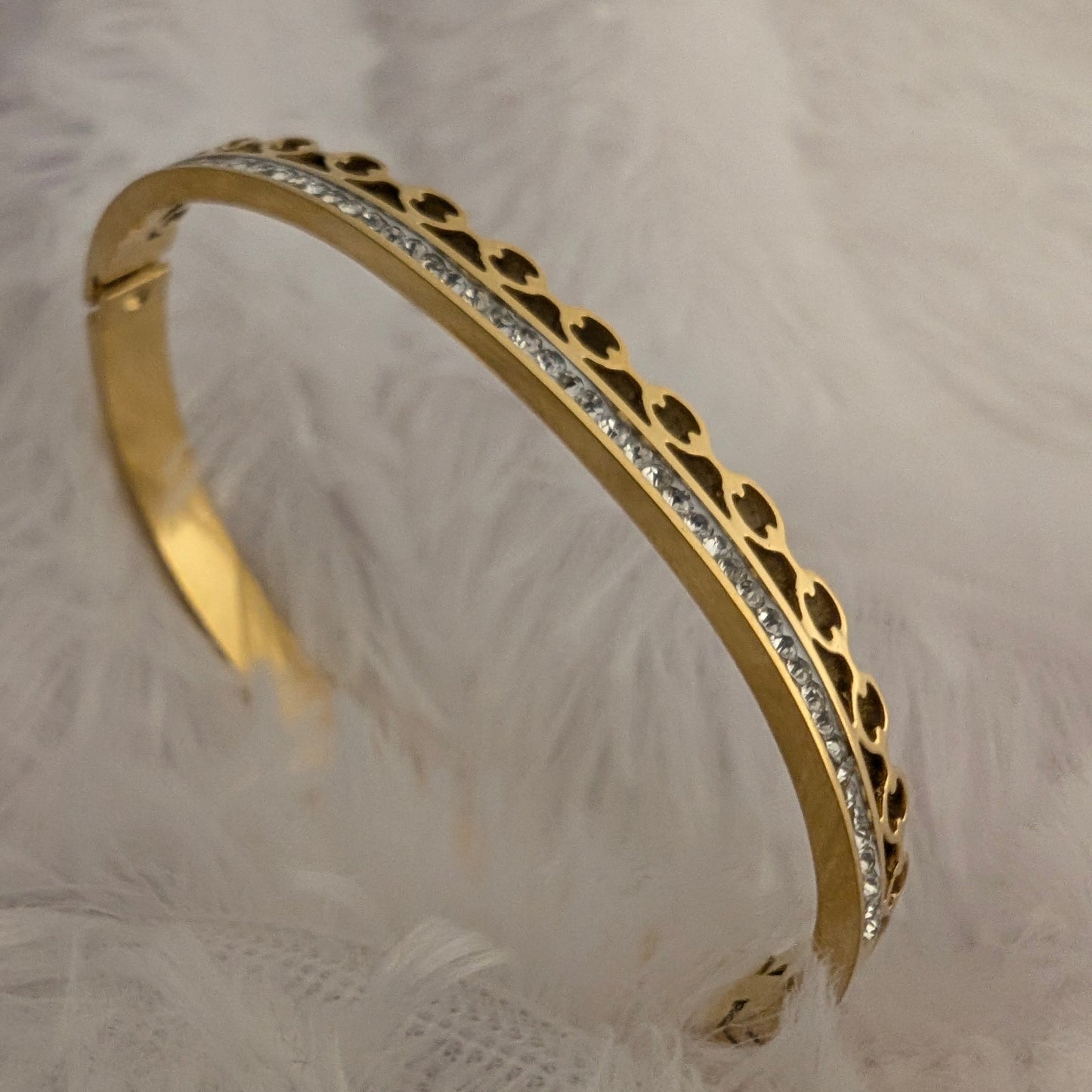 Gold bracelet with intricate design and studded white stones 18k gold plated antitarnish