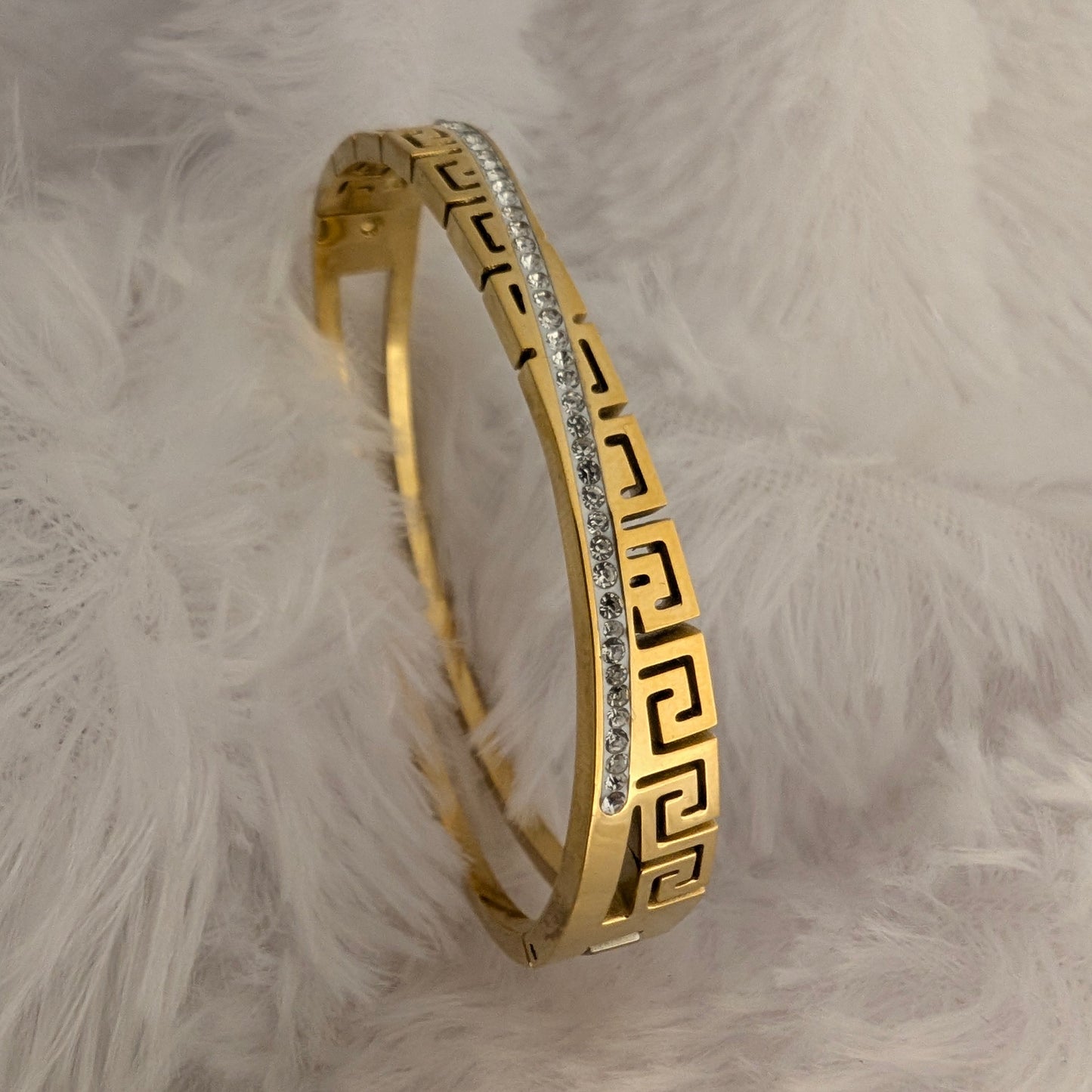 Gold bracelet with greek pattern and cross stones line