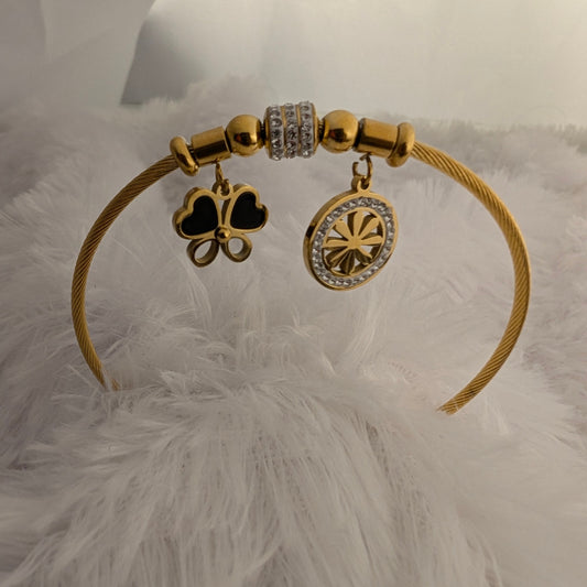 Gold bracelet with Flower and Chakra charms
