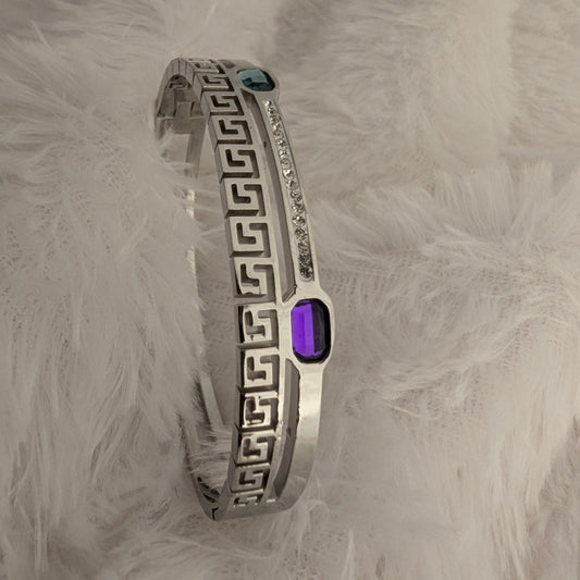 Silver bracelet with a purple  and sea green gemstone