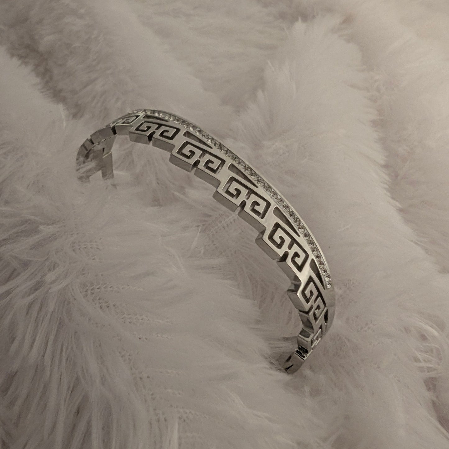Silver bracelet with Greek key design and studded white stones