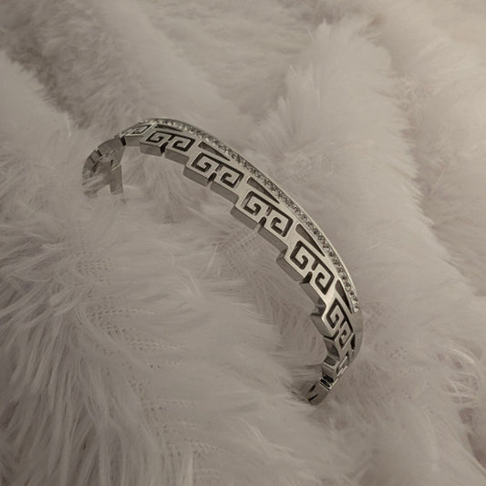 Silver bracelet with Greek key design and studded white stones