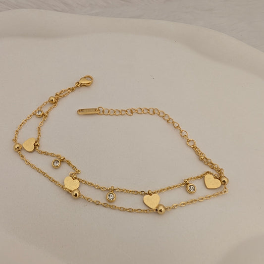 Gold layered bracelet with heart-shaped charms