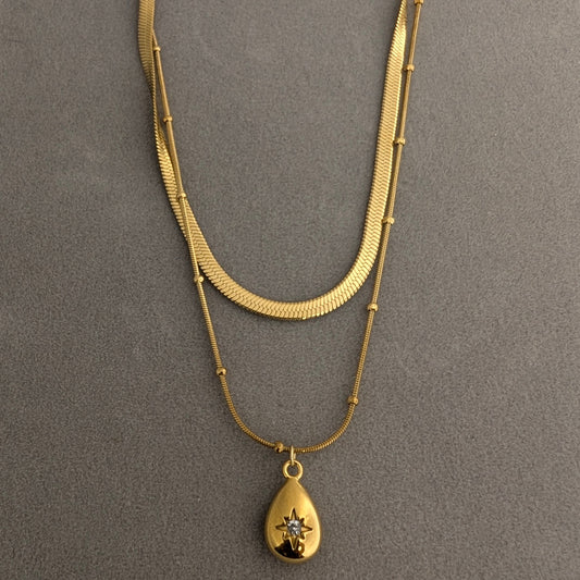 Layered Gold necklace with a teardrop pendant