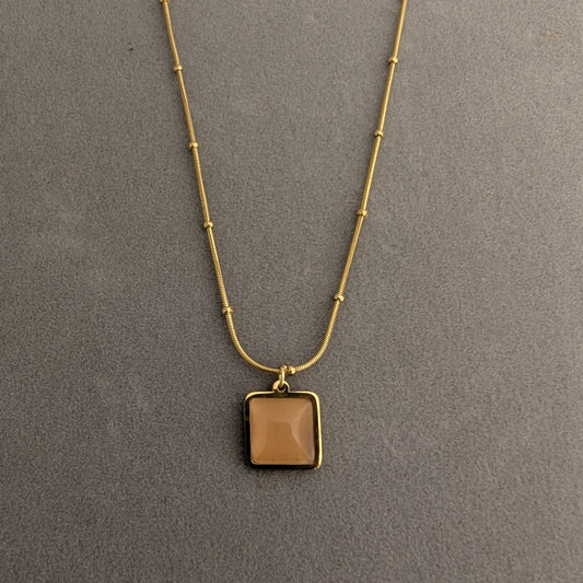 Gold necklace with a square pendant
