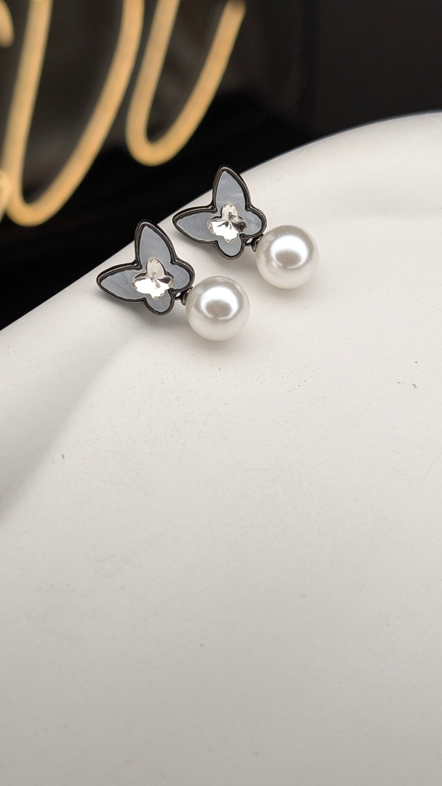 Butterfly pearl drop earrings