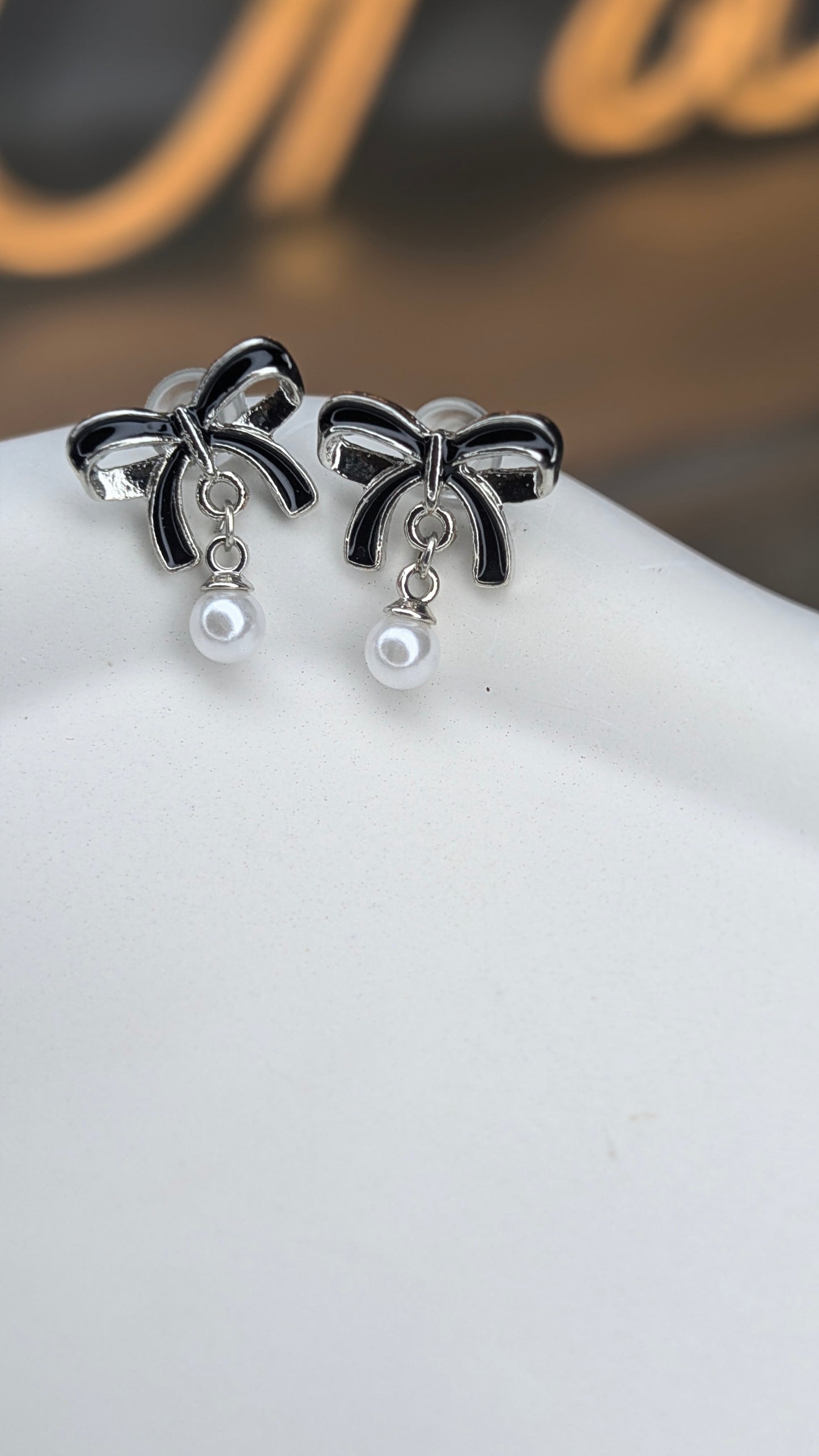 Pearl drop bow stud earrings