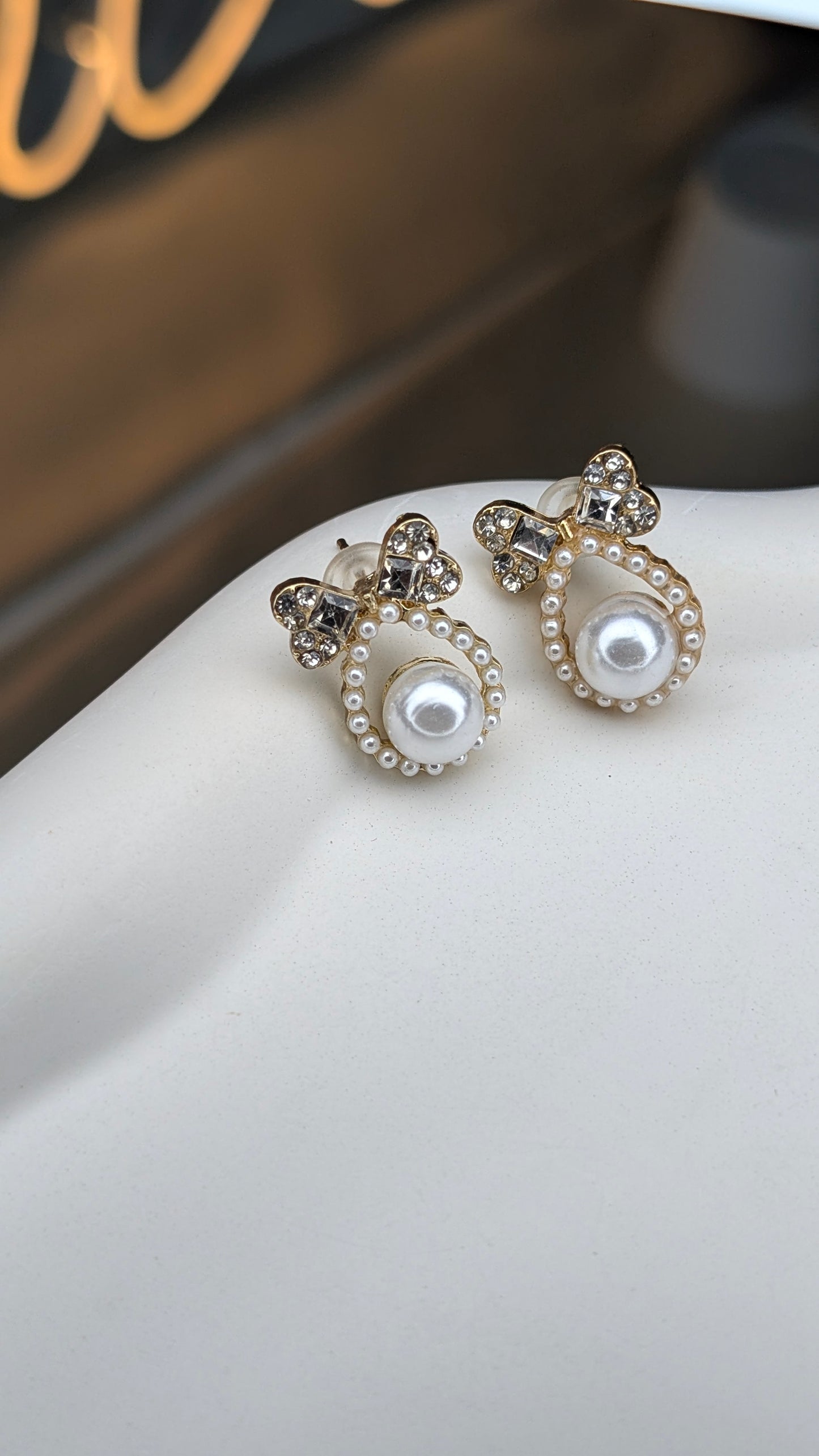 Bow pearl halo stud earrings
