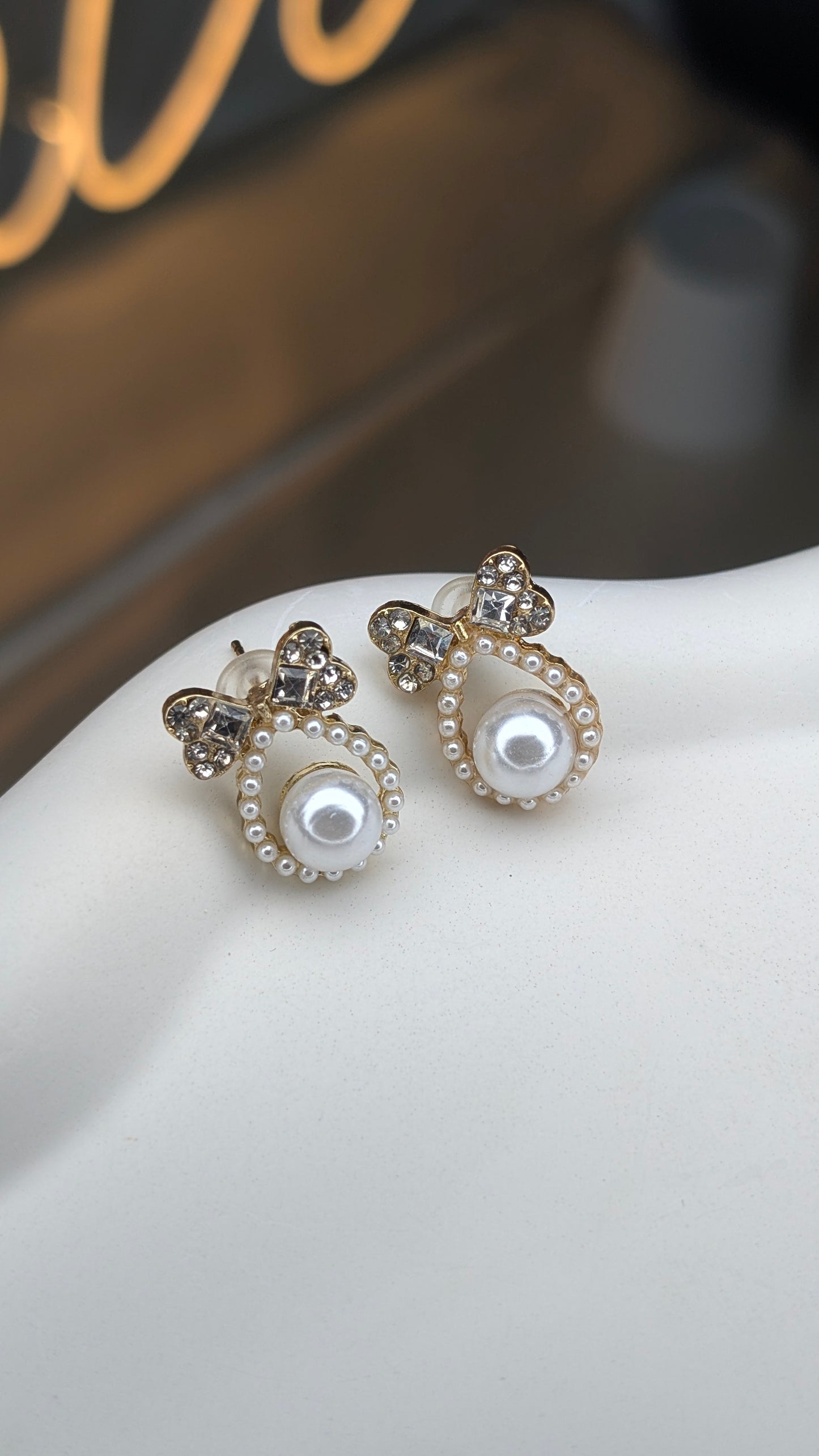 Bow pearl halo stud earrings