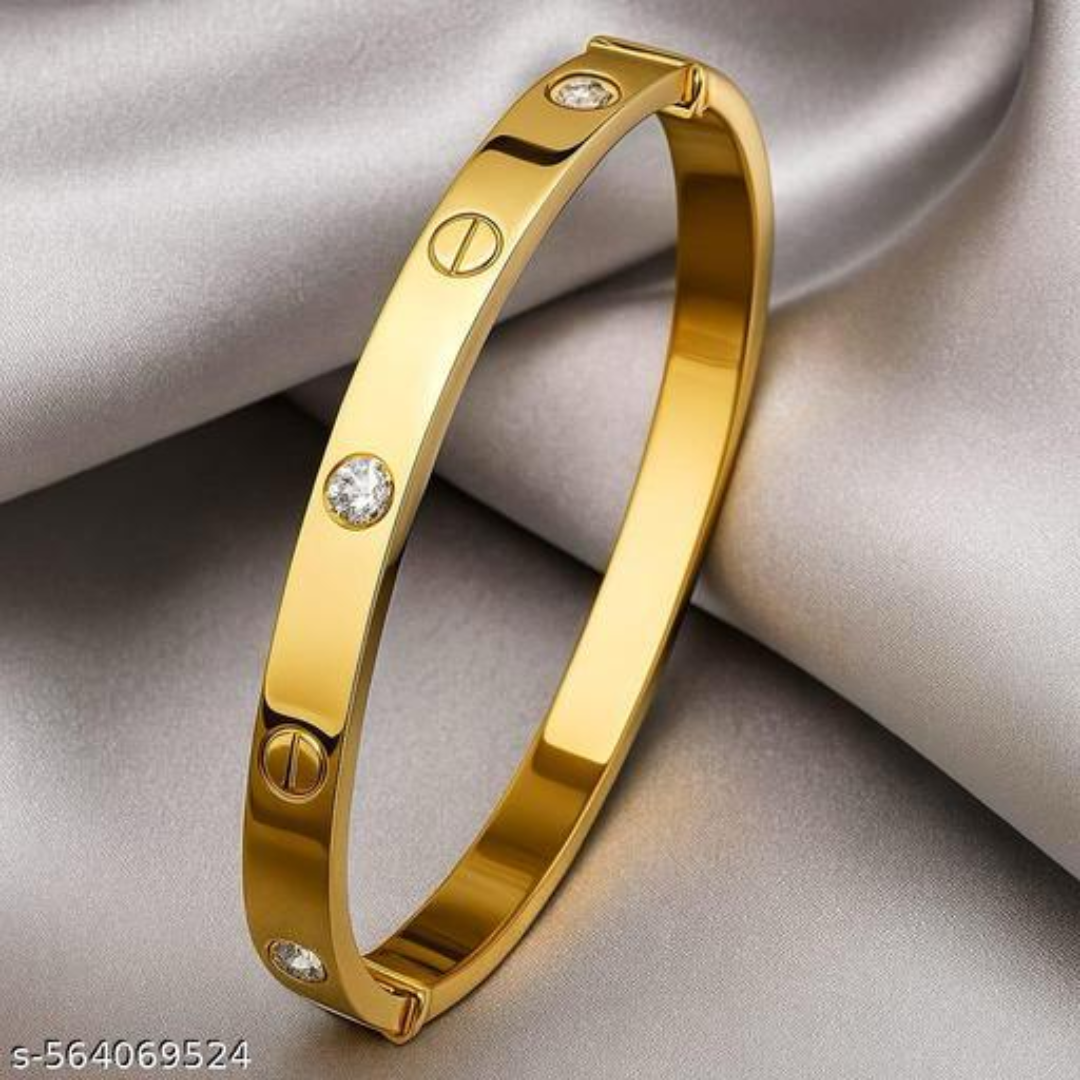 Gold bracelet with diamond accents on a light gray background